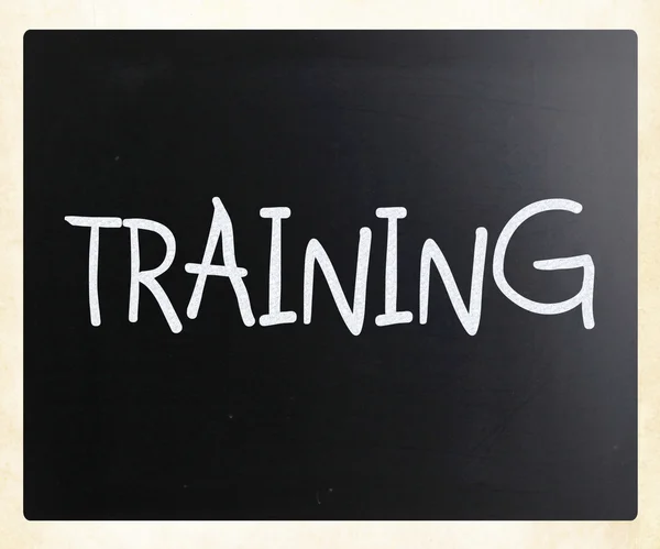 "Training" handwritten with white chalk on a blackboard — Stock Photo, Image