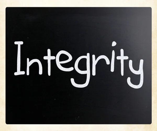 The word "Integrity" handwritten with white chalk on a blackboar — Stock Photo, Image