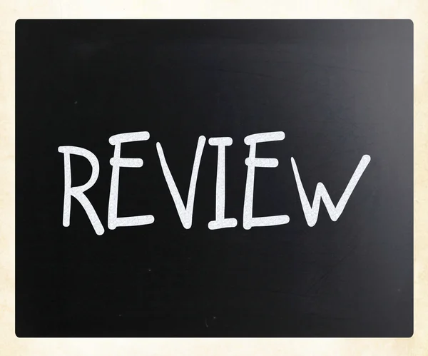 "Review" handwritten with white chalk on a blackboard — Stock Photo, Image