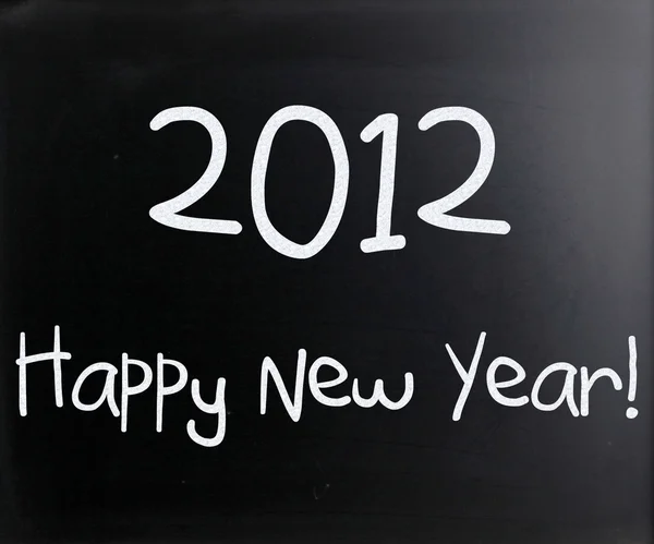 "felice anno nuovo "scritto a mano con gesso bianco su una lavagna — Foto Stock