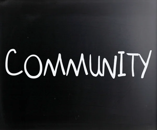 "Community" handwritten with white chalk on a blackboard — Stock Photo, Image
