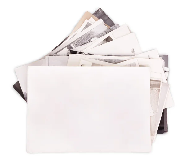 Stack of old photos with empty frame — Stock Photo, Image
