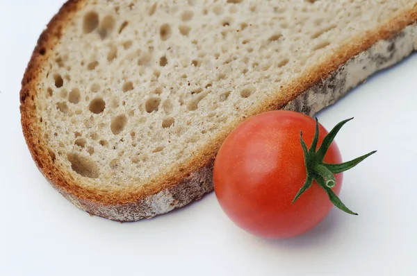 Slice of bread with tomato — Stock Photo, Image