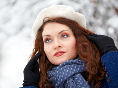 Beautiful young woman outdoor in winter clipart