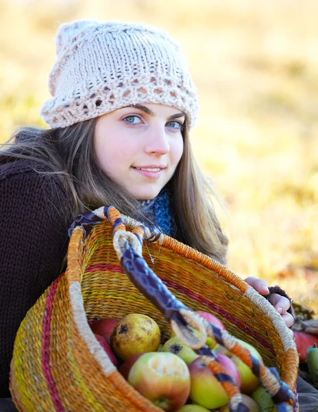 stock image Young woman with fruit basket