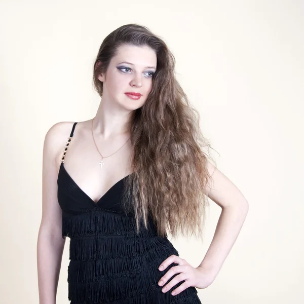 stock image Portrait of young beautiful girl in a black dress