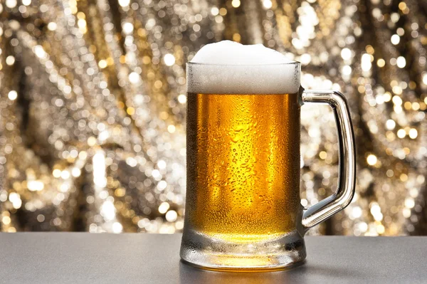 stock image Beer mug in front of a glittering background