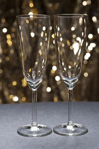 Champaign glass in front of glitter background — Stock Photo, Image