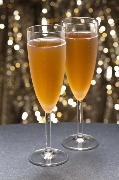 Champaign glass in front of glitter background — Stock Photo, Image