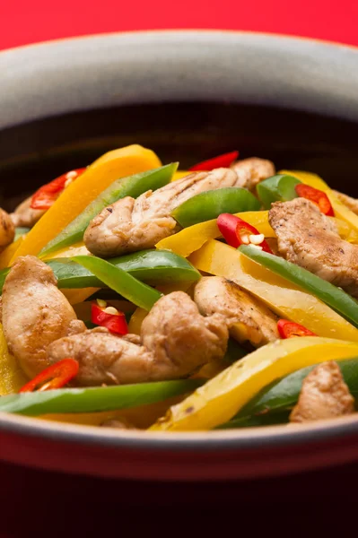 stock image Fried Chicken with capsicum on red table cloth