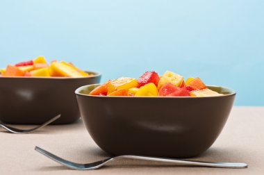 Two bowl of Mixed tropical fruit salad clipart