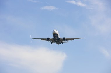 Boeing 737 makes its landing approach to oporto clipart