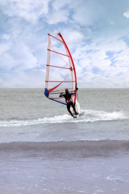 Windsurfing in a storm clipart