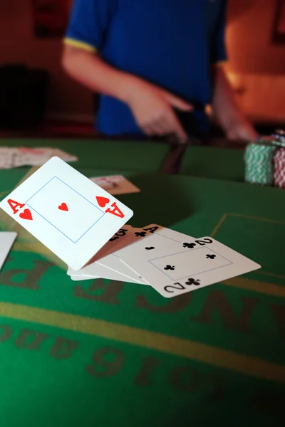Poker player throwing in loosing cards — Stock Photo, Image