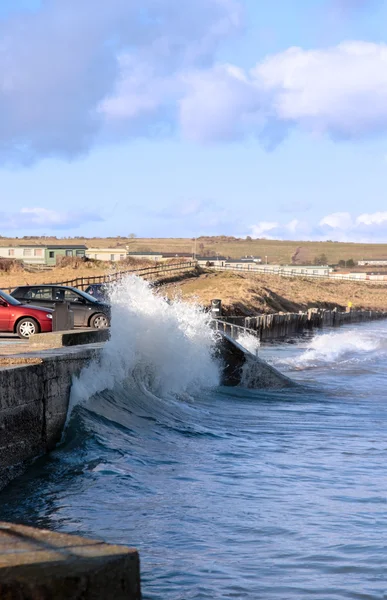 Waves crashing against seaside wall — Stock Photo, Image
