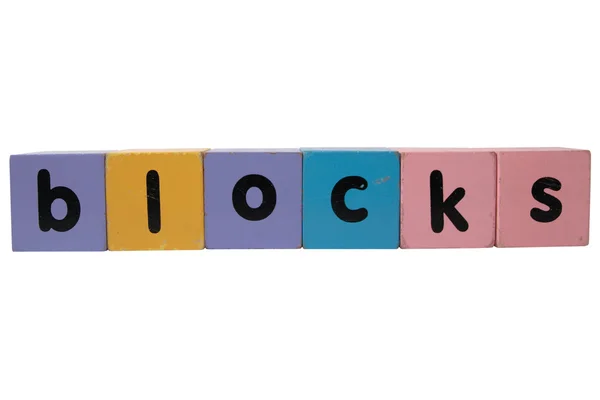 Blocks in wood play block letters against white — Stock Photo, Image