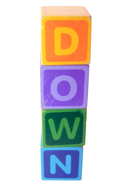 Down in wood play block letters with clipping path — Stock Photo, Image