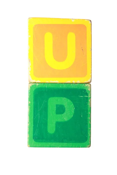 Arriba en el juguete jugar letras de bloque con camino de recorte —  Fotos de Stock