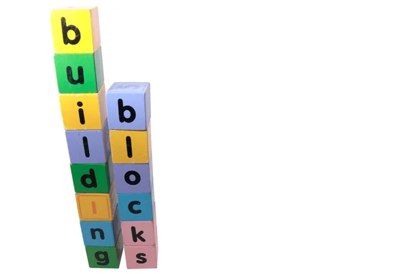 Bloki literami przed biały — Zdjęcie stockowe