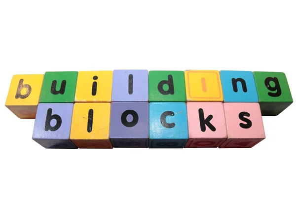 Building blocks letters against white — Stock Photo, Image