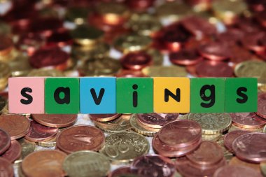 Coin savings in toy letters clipart