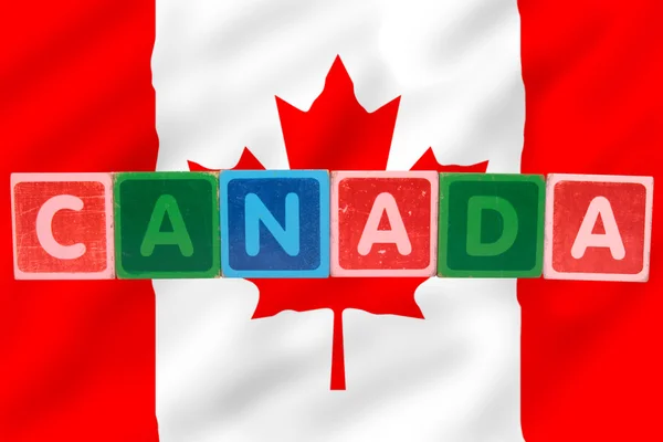 stock image Canada and flag in toy block letters