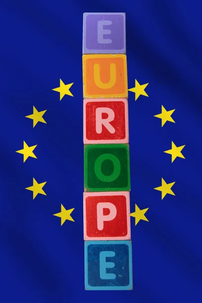 Europe and flag in toy block letters — Stock Photo, Image