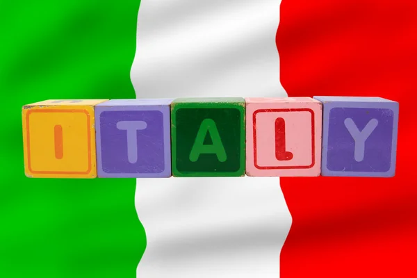 Italy and flag in toy block letters — Stock Photo, Image