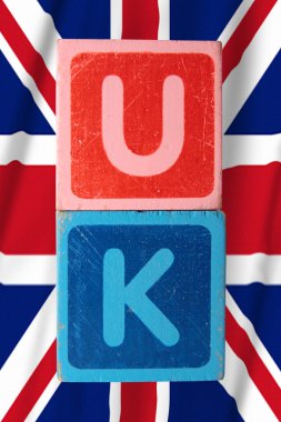 Uk and flag in toy block letters clipart