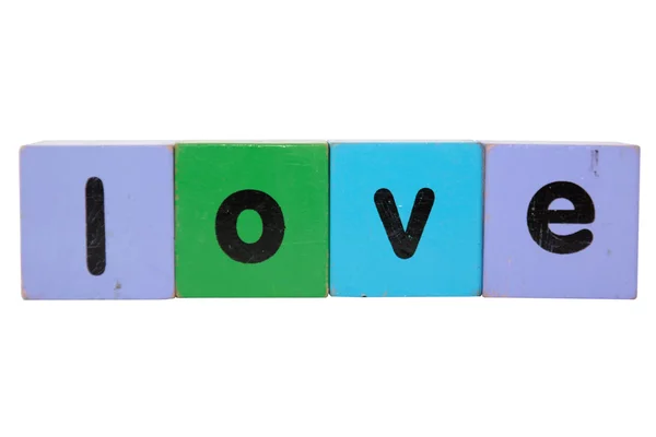 Amor no brinquedo jogar letras de bloco com recorte caminho — Fotografia de Stock