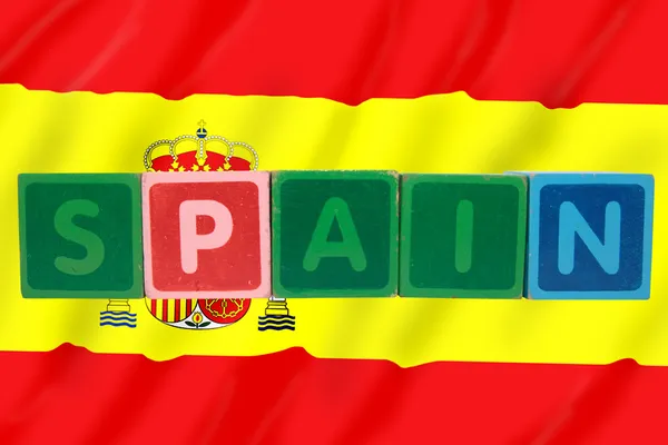 Spain and flag in toy block letters