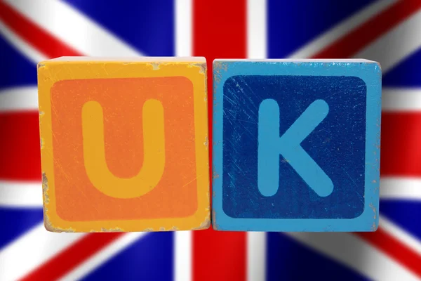 Verenigd Koninkrijk en vlag in speelgoed brieven — Stockfoto