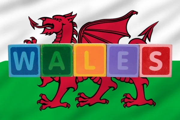 Wales and flag in toy block letters — Stock Photo, Image