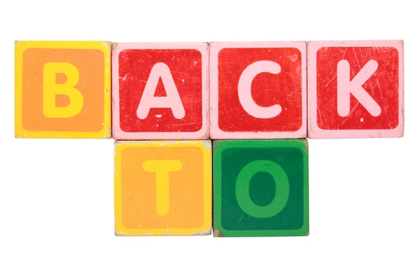 Voltar em letras de bloco de brinquedo — Fotografia de Stock