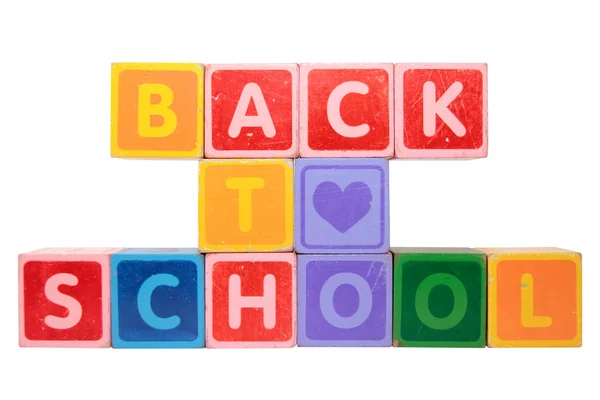 Loving back to school in toy block letters — Stock Photo, Image