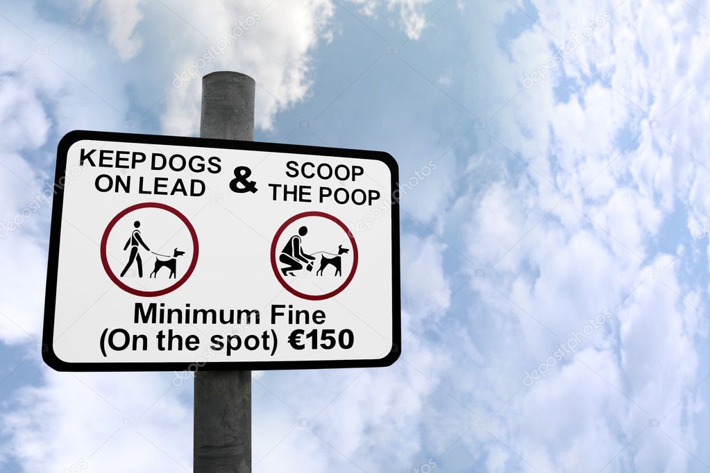 Scoop the poop sign against clouds