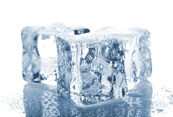 Three ice cubes with water drops Stock Photo