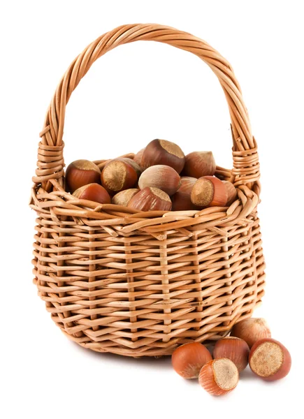 Wicker basket with hazelnuts — Stock Photo, Image