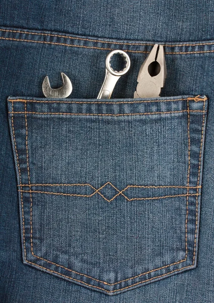 Instruments in the pocket of blue jeans — Stock Photo, Image