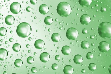 Water drops on green glass surface clipart