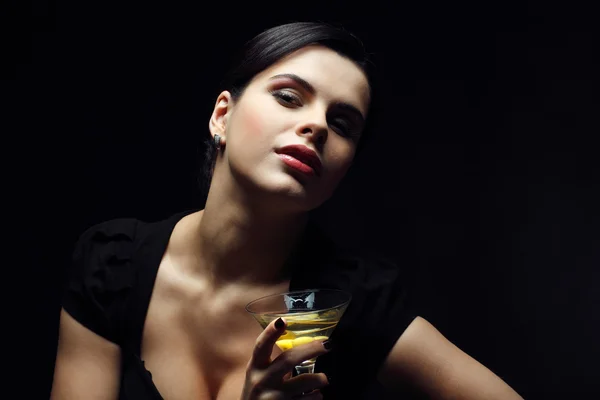 Beautiful young girl with glass of martini — Stock Photo, Image