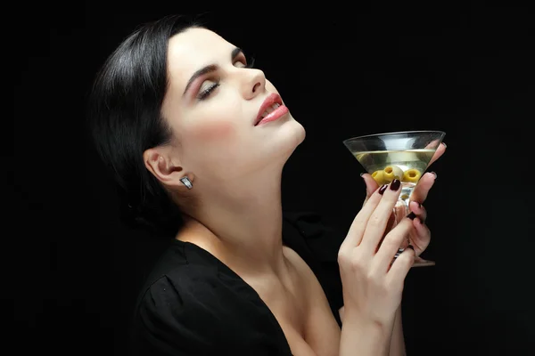 Beautiful young girl with glass of martini — Stock Photo, Image