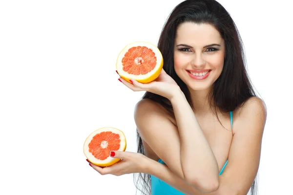 Girl in a turquoise swimming suit with a pink grapefruit, isolated on a white background, emotions — Stock Photo, Image