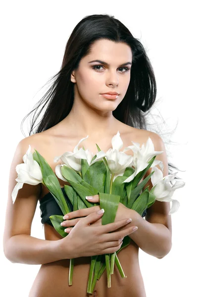 Vacker ung flicka med tulpaner, isolerad på en vit bakgrund — Stockfoto