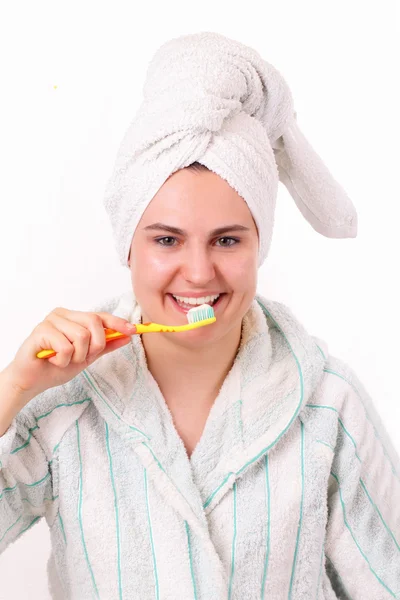 Beautiful girl brushes her teeth — Stock Photo, Image