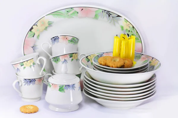 The dishes, candles and biscuits — Stock Photo, Image