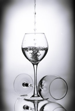 Two wineglasses and drops of water