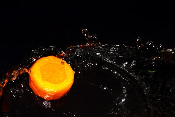 Carrot and water Stock Image