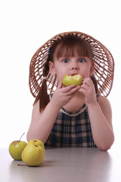 A little girl eating a tasty apple — Stock Photo, Image