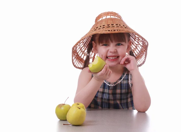 A little girl eating an apple — Stock Photo, Image